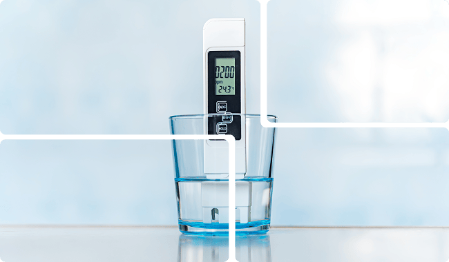 a digital thermometer in a glass of water