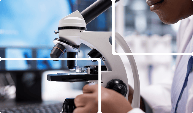 a scientist looking through a microscope