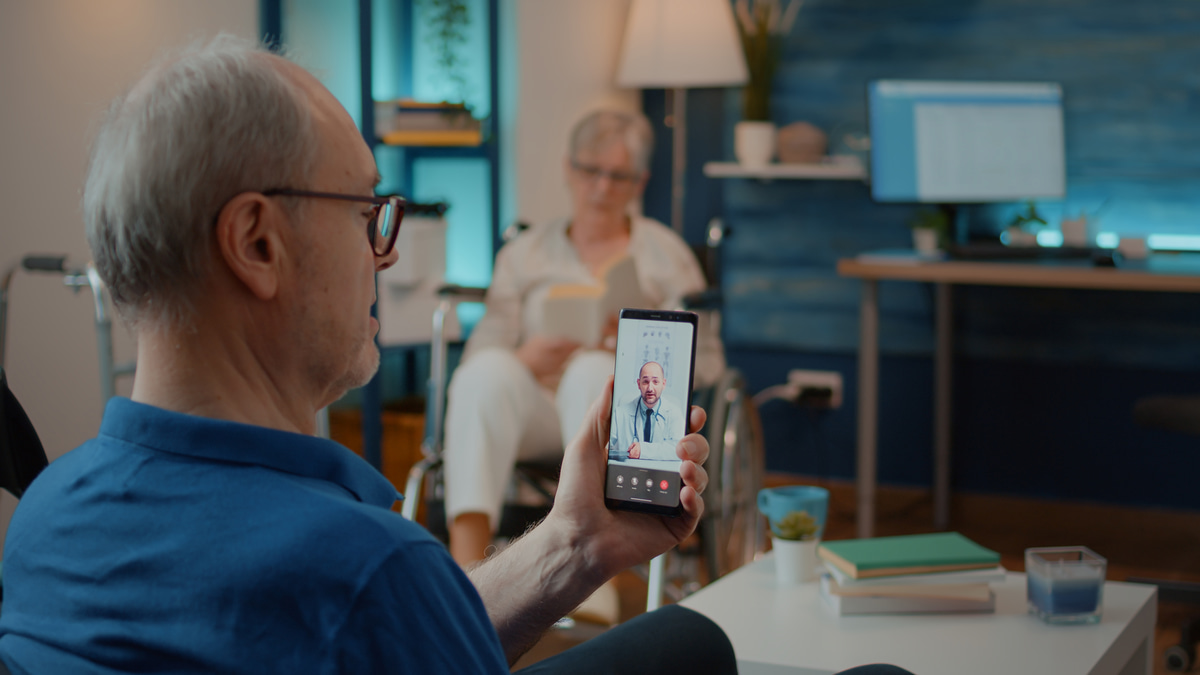 Doctor using a tablet for a telehealth consultation, showcasing digital health platforms.