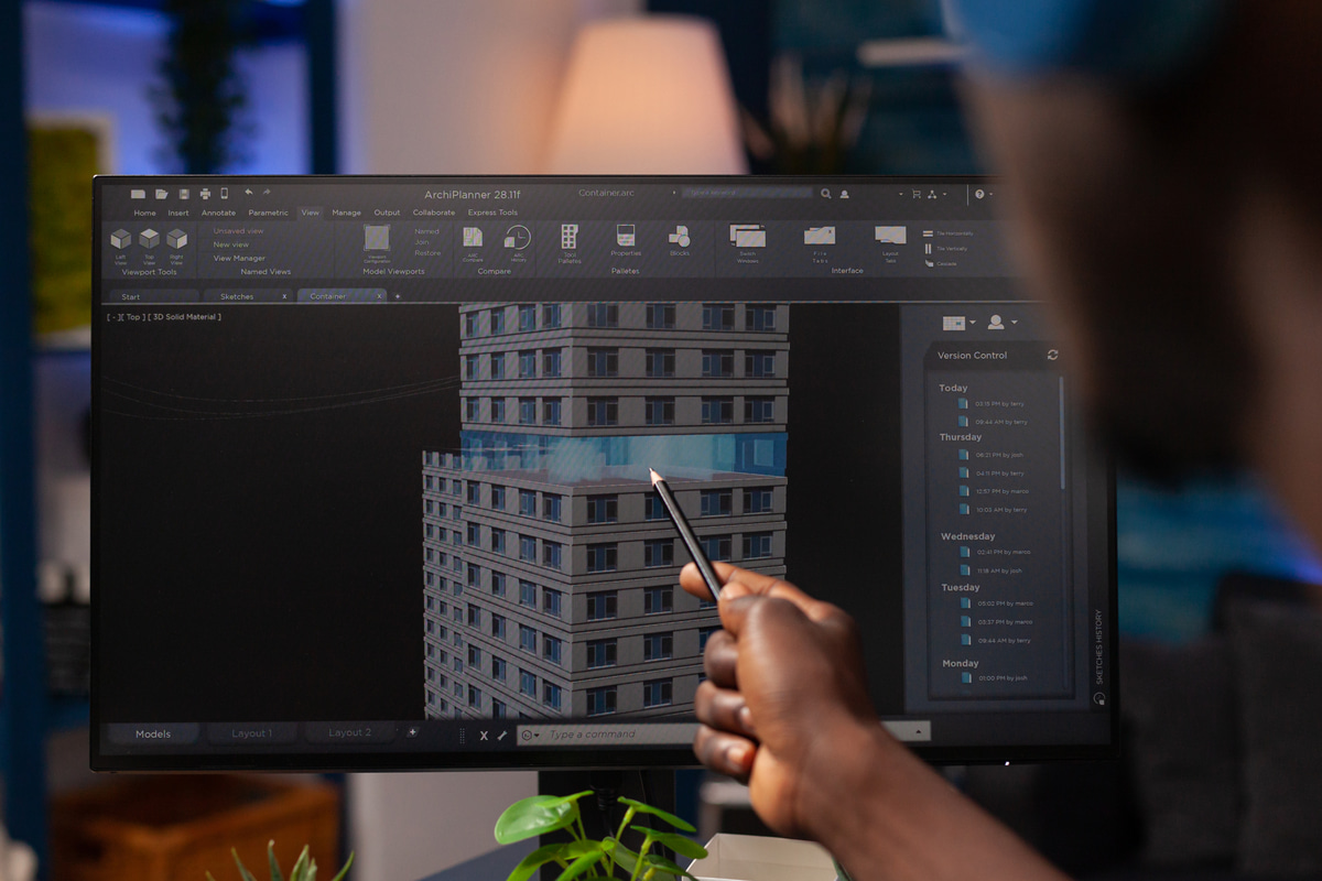 Detailed 3D BIM model of a building structure on a computer screen.