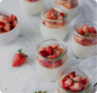 yogurt with strawberries in mason jars