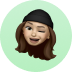 an emoji of a girl wearing a hat