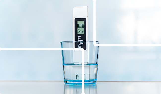 a digital thermometer in a glass of water