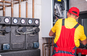 a plumber working on a water heater