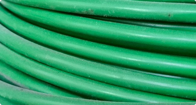 a close up of a bunch of green hoses