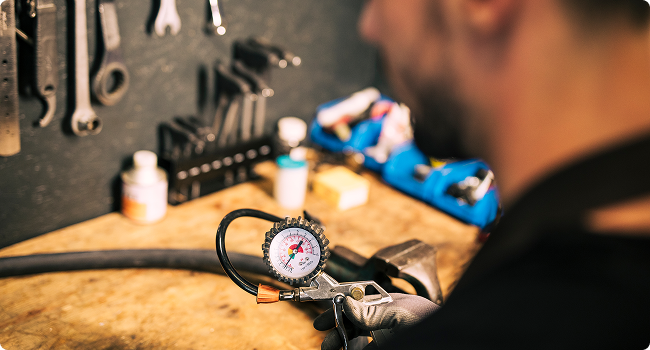 a mechanic working on a bike