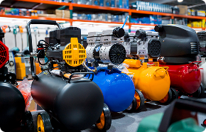 a row of air compressors in a warehouse