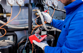 a man working on an air conditioner