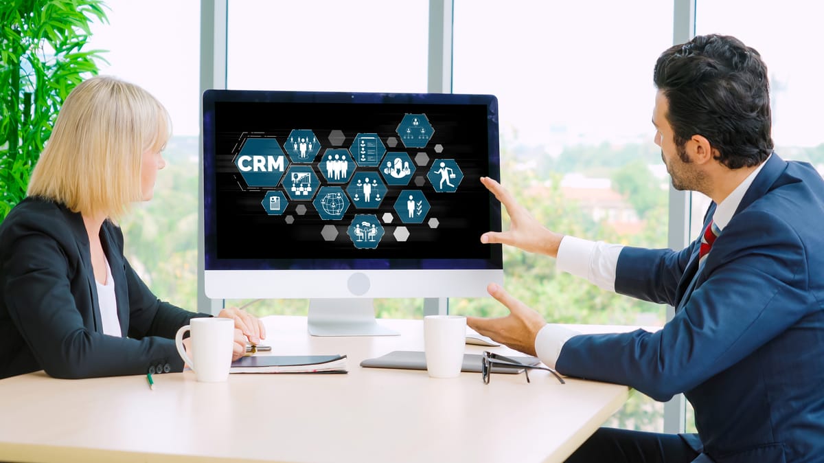 Team collaborating on a project using a large interactive screen.